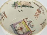a white bowl with a picture of a woman and a cat on it