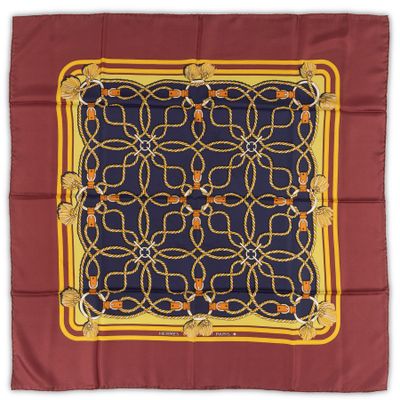 a close up of a square scarf on a white background