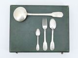 a spoon, fork, spoon and spoon rest on a green tray