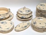 a lot of plates and bowls that are sitting on a table