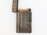 an old lighter is sitting on top of a white surface