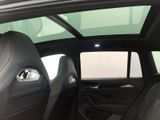 the interior of a car with a sunroof and a rear seat