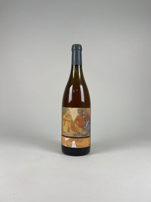 a bottle of wine that is sitting on a table
