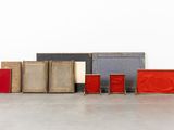 a lot of books that are sitting on the floor