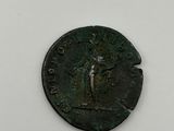 a coin with a man holding a sword on top of it