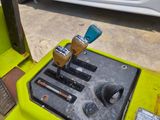 a close up of a yellow forklift with a blue handle