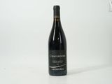 a bottle of wine that is sitting on a table