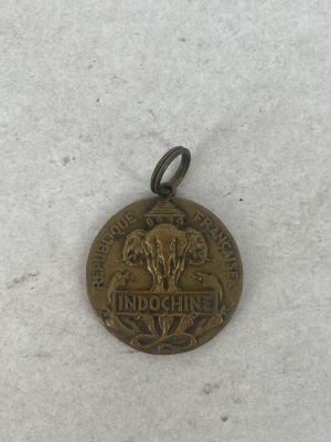 a close up of a medal on a snow covered surface