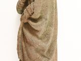 a stone statue of a man with a hood on