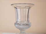 a glass vase sitting on top of a white table