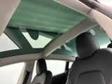 a view of the sunroof from inside of a car