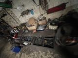 a car parked in a garage with a lot of tools