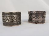 pair of antique silver napkins with floral designs