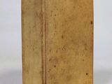 an old book that is sitting on a table