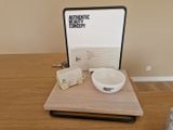 a white bowl sitting on top of a wooden table