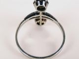 sterling silver ring with a black diamond and a cross on the side