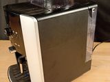 an image of a coffee machine on a wooden table