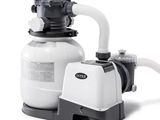 a close up of a pool pump with a hose attached to it