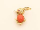yellow gold plated rabbit brooch with coral stone eyes and ears