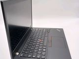a laptop with a black keyboard sitting on a white surface