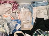 a pile of clothing that is sitting on a table
