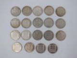 some coins are arranged in a circle on a white surface