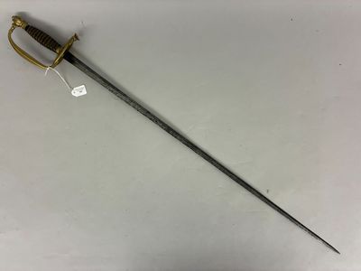 an old sword with a wooden handle on a white surface