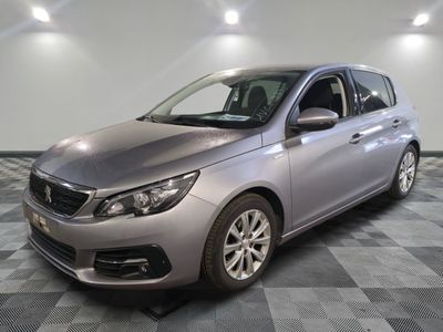 a picture of a silver car parked in a garage