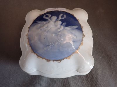 a blue and white plate with a picture of a snowman on it