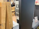 a refrigerator that is sitting in a warehouse with other appliances