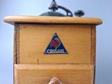 a small wooden box with a sticker on it