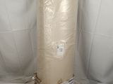 a roll of fabric wrapped in plastic on a white surface