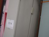 a refrigerator that is sitting in the middle of a room