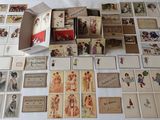 a lot of old postcards on the table