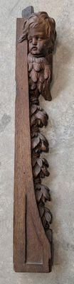 Element décoratif En bois sculpté à décor d'une tête d'angel… - Photo 1