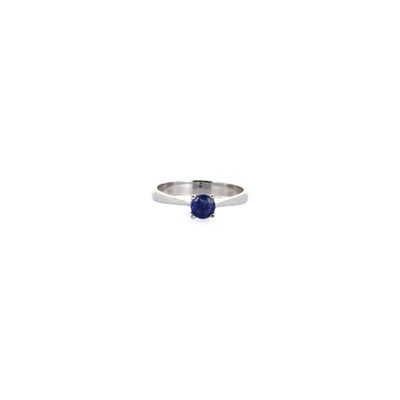 a close up of a ring with a blue stone on it