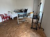 a room with a ladder and a table in it