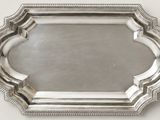 a silver tray with a decorative design on it
