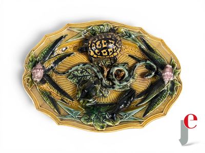 a decorative plate with a skull and two birds on it