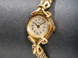 an image of a close up of a wrist watch on a napkin