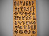 a wooden plaque with a variety of items on it