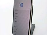 a phone that is sitting on a stand on a table