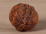a close up of a nut on a wooden table