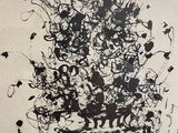 a black and white picture of a vase of flowers