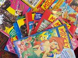 a pile of children ' s books sitting on the floor