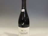a bottle of wine that is sitting on a table
