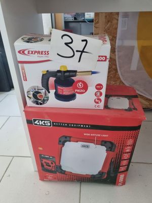 the box is open on the floor next to the box with the contents in it