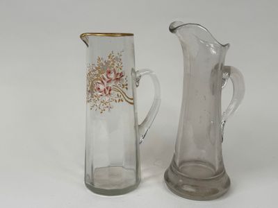 two vases sitting next to each other on a white surface