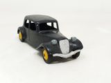 a toy car that is sitting on a white surface