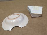 a small bowl and a small bowl sitting on a table
